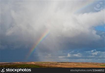 Field and rainbow on the isle of Islay