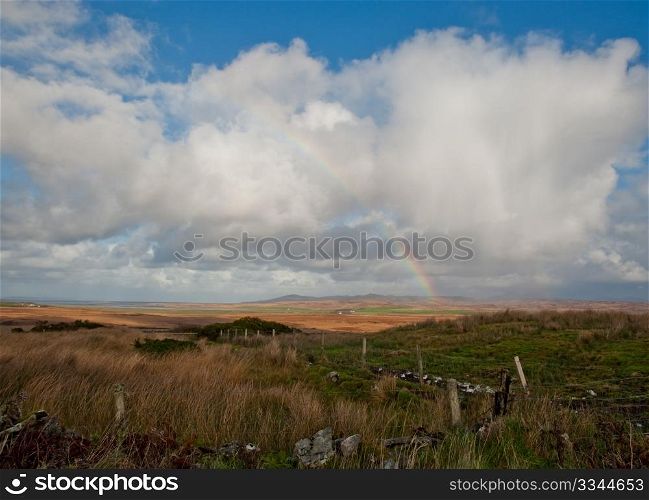 Field and rainbow on the isle of Islay