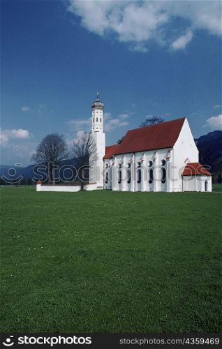 Field in front if a church, Bavaria Country Church, Saint Coleman&acute;s Church, Schwangau, Germany