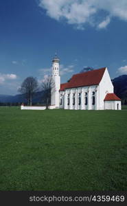 Field in front if a church, Bavaria Country Church, Saint Coleman&acute;s Church, Schwangau, Germany
