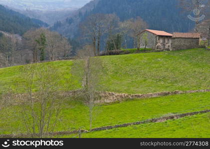 Field on the Slopes of The Pyrenees With Old Farmhouses