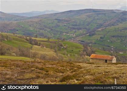 Field on the Slopes of The Pyrenees With Old Farmhouses