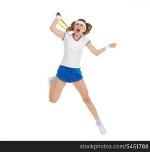 Fierce tennis player jump to hit ball