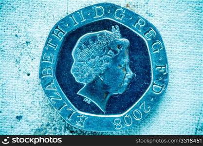 Fifty pence on canvas background in blue tone