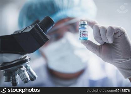 fight against COVID-19, coronavirus vaccine research in hospital laboratory, professional scientists holds bottle of new vaccine for virus cure treatment injection, medicine clinical during pandemic