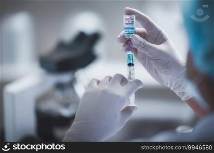 fight against COVID-19, coronavirus vaccine research in laboratory, professional scientists holds syringe and bottle vaccine for virus cure treatment injection, medicine clinical during pandemic