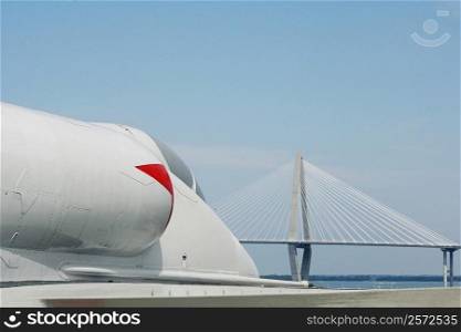 Fighter plane on an aircraft carrier with a suspension bridge in the background, Cooper River Bridge, Cooper River, Patriot&acute;s Point, Charleston Harbor, Charleston, South Carolina, USA
