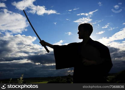 Fighter with a sword silhouette a sky ninja