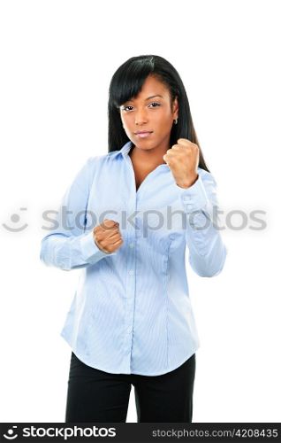 Fighting black woman showing fists isolated on white background
