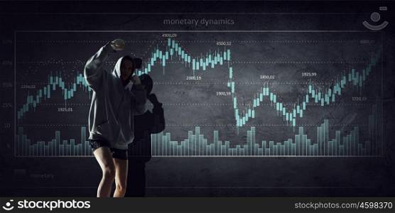 Fighting for sales dynamics. Boxer woman over dark background with graphs and diagrams