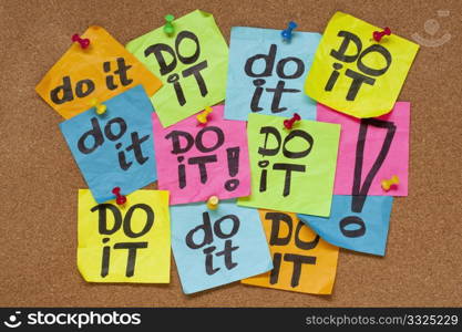 fighting procrastination concept - do it phrase on color sticky notes posted on a cork bulletin board