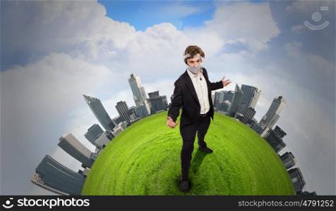 Fighting with air pollution. Young businessman with tie protecting his mouth