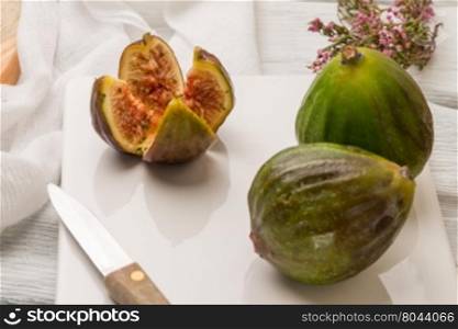 Figs and honey on a wooden table selective focus.