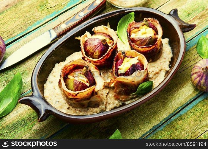 Figs fried with cheese baked with bacon and Greek yogurt sauce.. Figs roasted in bacon