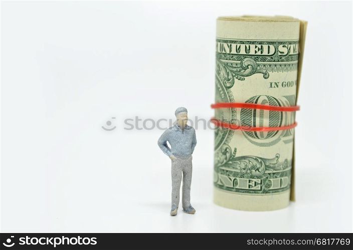 Figure of businessman and one dollar bill. Wealth concept