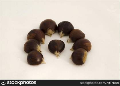 Figure of fresh chestnut fruits on white background
