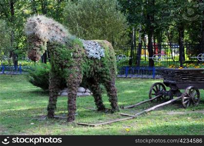 Figure of horse made from plants in the park