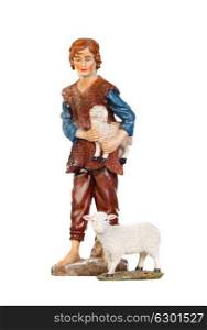 Figure of the shepherd with a sheep for the nativity portal isolated on a white background