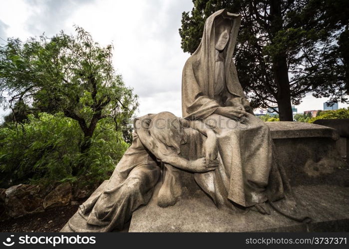 Figures and crosses of an old cemetery in Barcelona