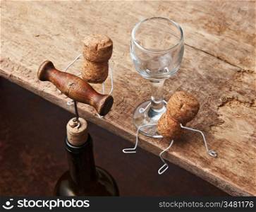 Figures from wine corks and bottle with the corkscrew