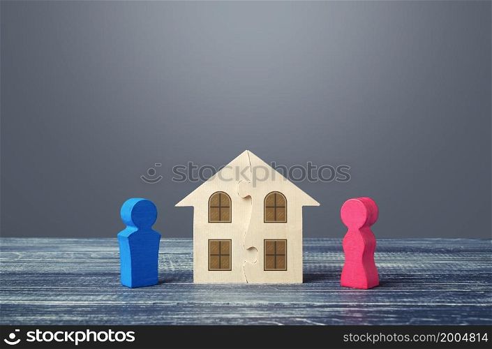 Figures of husband and wife and house puzzle. Marriage contract. Buying or building a dream home. Division of marital property real estate. Dispute. Conflict resolution. Legal regulation. Divorcement