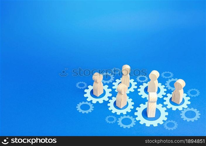 Figures of people interact with gears. Joining efforts and cooperation. Corporate machine. Communication in running company. Goal achievement. Joint development. Join team group. Teamwork