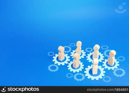 Figures of people interact with gears. Joining efforts and cooperation. Corporate machine. Communication in running company. Goal achievement. Joint development. Join team group. Teamwork