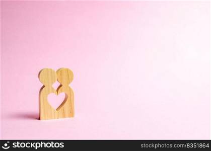 Figures of people stand together and form a heart-shaped void. Concept of love and relationships. Search for a partner and dating. Flirting, swingers. The second half on Valentine’s Day.
