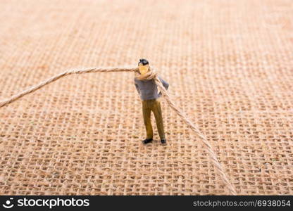 Figurine man with a rope on the neck