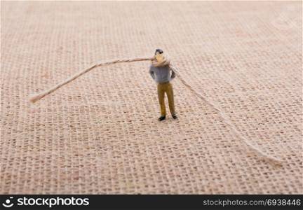 Figurine man with a rope on the neck