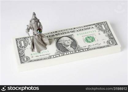 Figurine of a fortune teller on US paper currency