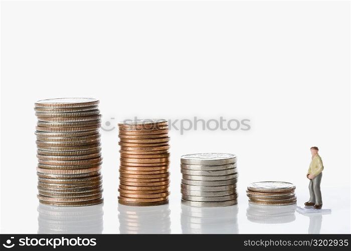 Figurine of a man with stacks of coins