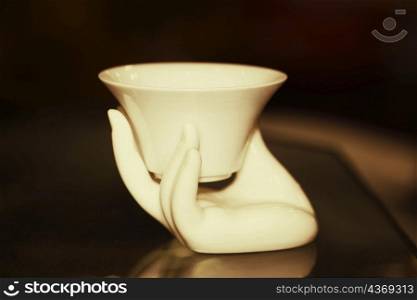 Figurine of a person&acute;s hand with a bowl, Hefei, Anhui, China