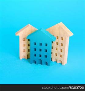 Figurines of multi-storey residential buildings. Housing and accommodation. Buying and selling real estate. Urbanization and city management. Mortgage loan. Repair and construction.