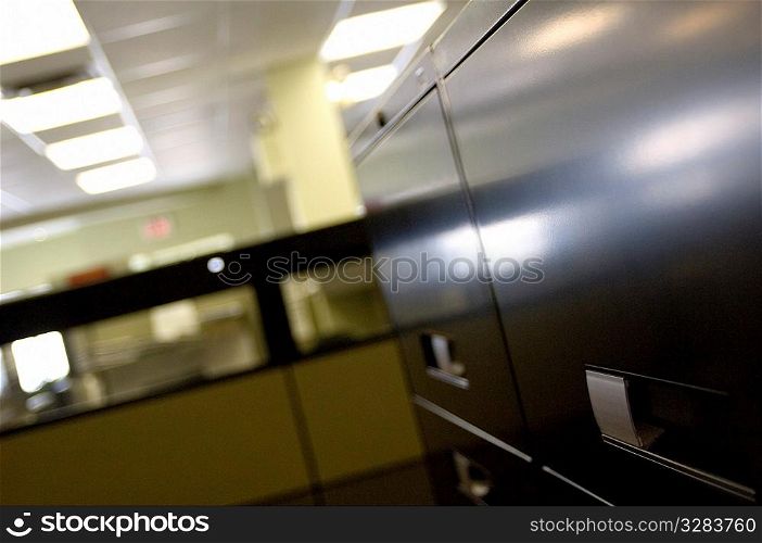Filing cabinets in office cubicle.