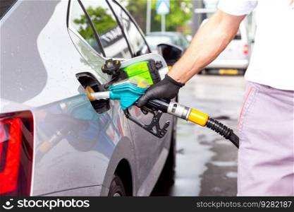 Fill up a car with diesel fuel at petrol station