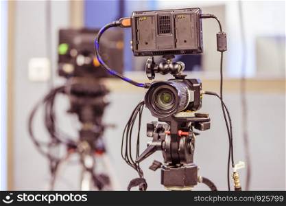 Film camera on a tripod in a television studio