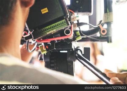 Film industry. cameraman shooting film scene with camera