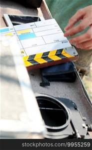 Film industry equipment, close up image of movie Clapper board on set