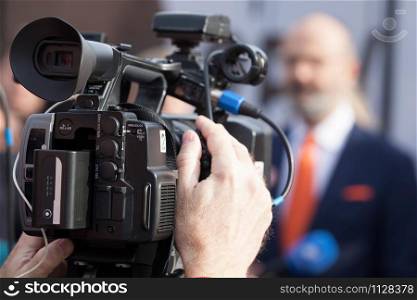Filming news or press conference with a video camera