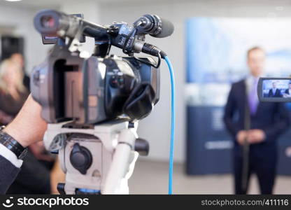 Filming news or press conference with a video camera