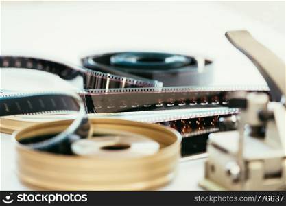 Filmstrip or film reel on a cutting table, vintage film production in cinema