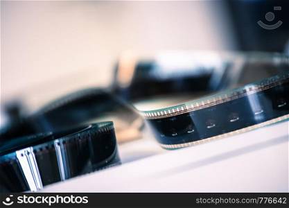 Filmstrip or film reel on a cutting table, vintage film production in cinema