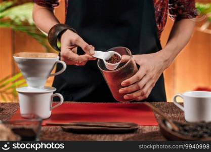 Filter Coffee. Hands of female making drip coffee