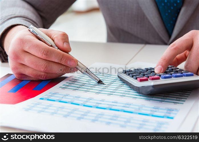 Finance analyst looking and financial reports
