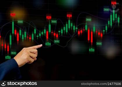 Finance and business investment concept. Stock and crypto investment funds.Businessman touching virtual screen data candlestick chart  trading Forex graphs of financial.