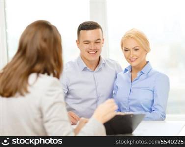 finance, bank, family and business concept - smiling couple at bank
