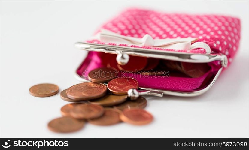 finance, cash, money saving and investment concept - close up of euro coins and wallet on table