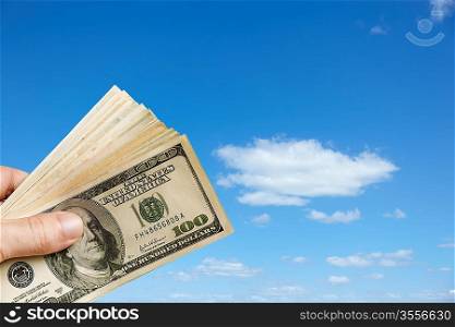 finance concept with cash and blue sky