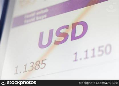 finance, currency and money concept - digital display with dollar exchange rate on screen